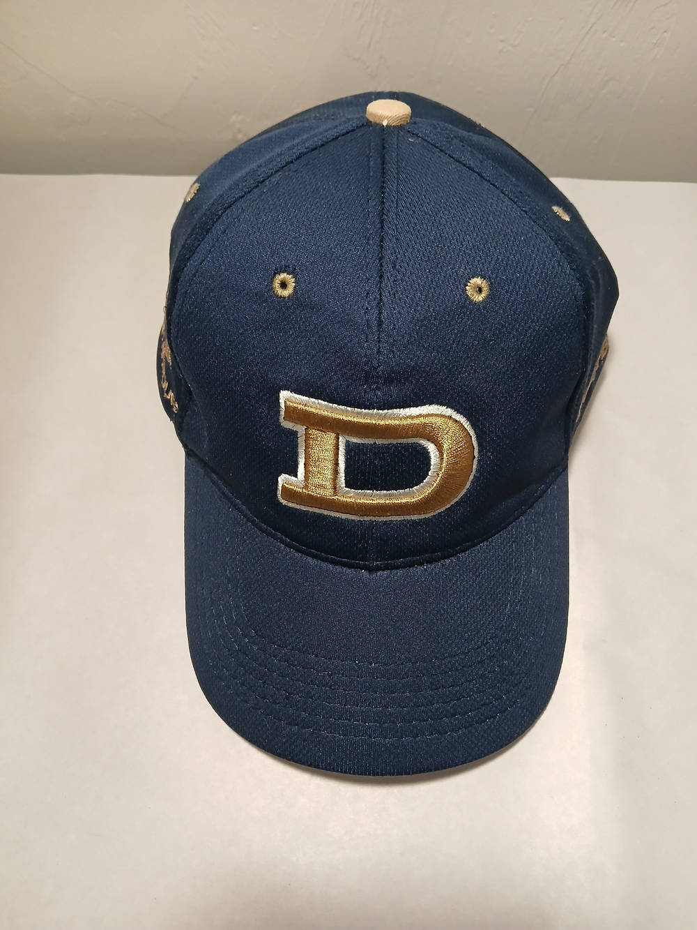 Under Armour Navy Blue and Gold Football Cap with Embroidered 'D'